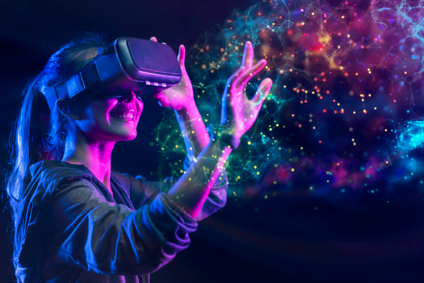 Young woman wearing VR headset, reaching out to touch multi-colored lights