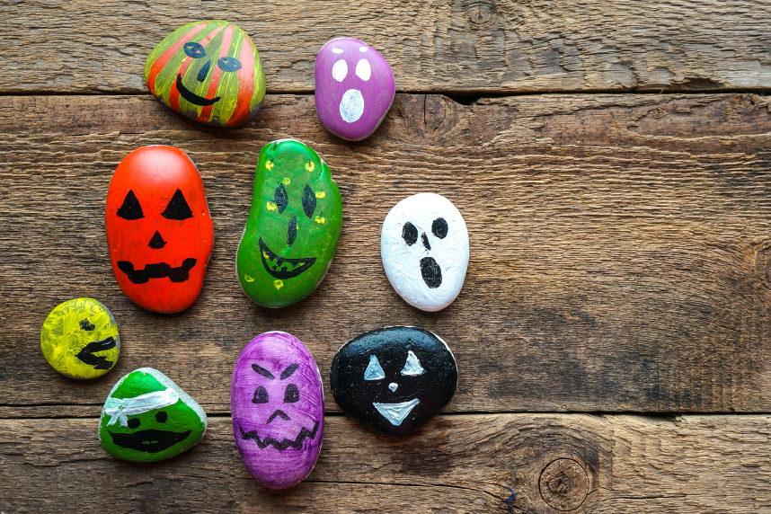 Rocks painted like ghosts, jack-o-lanterns, and monsters