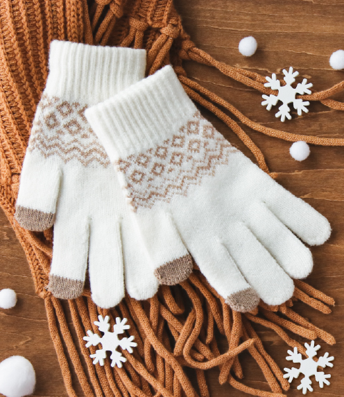 White and beige winter gloves with snowflake decorations and twine