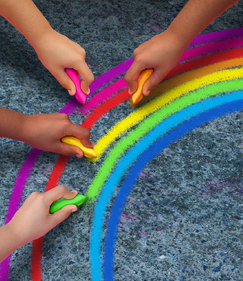Children drawing a rainbow with sidewalk chalk