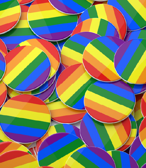 Pile of rainbow-striped pin-back buttons
