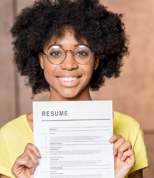 Smiling young woman holding up her resume