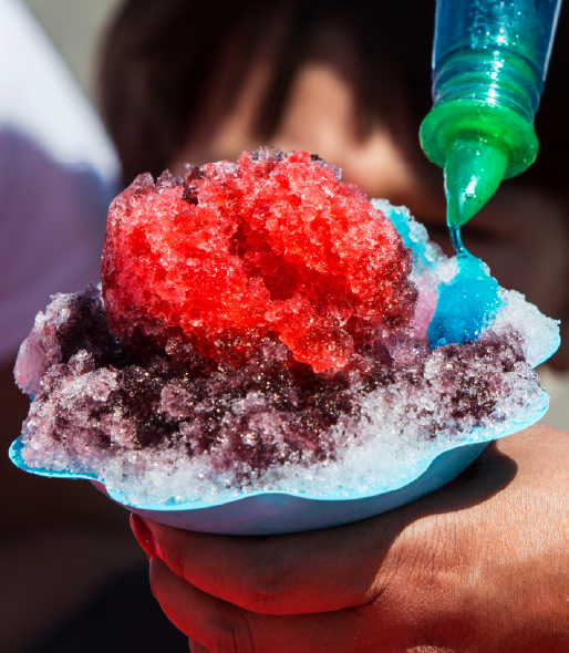 Close up of red and purple snow cone