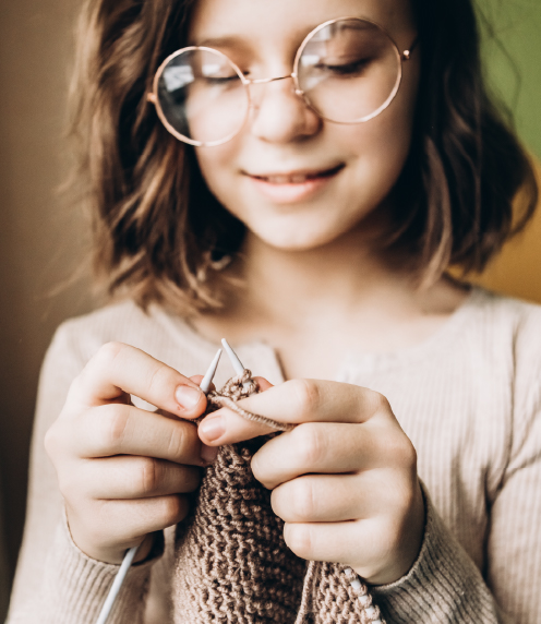 Teenage girl knitting