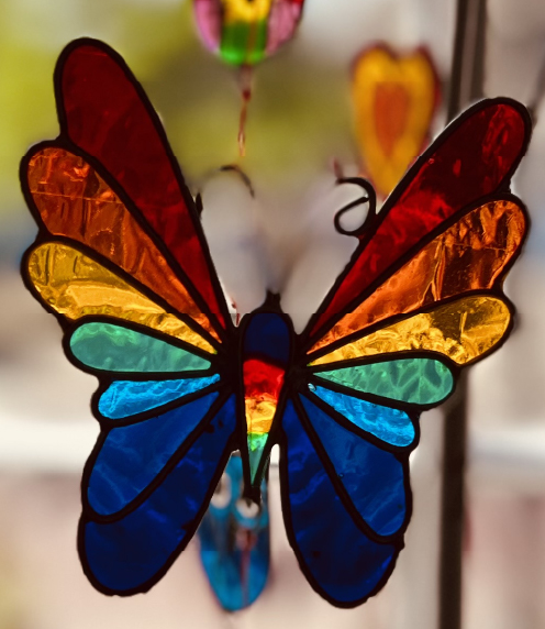 Stained glass butterfly in window