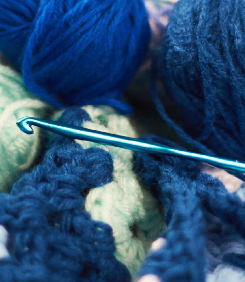Close up of crochet hook with yarn