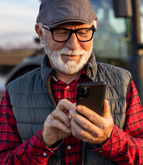 Image: Senior man looking at his phone.