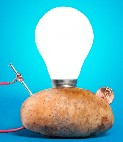 Potato with wire, a nail, a coin, and a light bulb