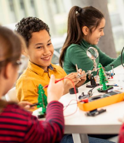 Group of children building a STEAM activity