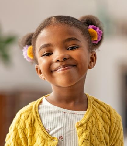 Confident young girl, smirking at camera