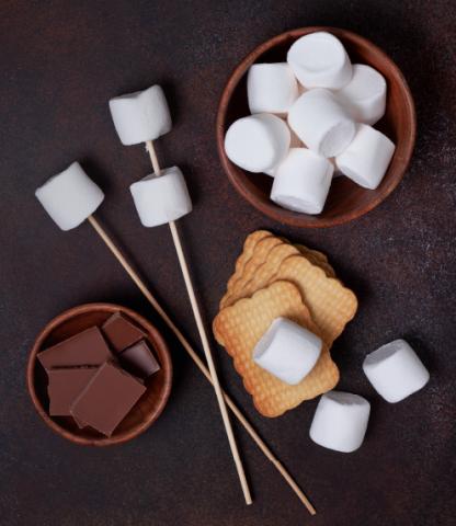 S'mores components including marshmallows, chocolate, and graham crackers