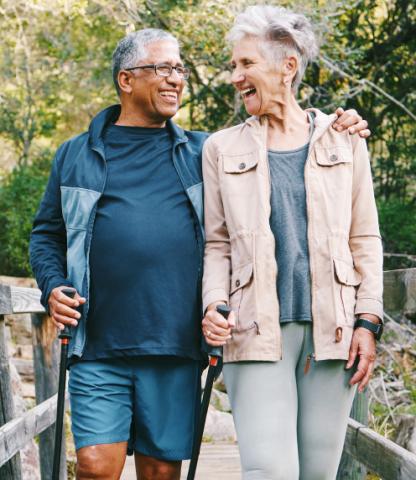 Senior couple walking in the woods