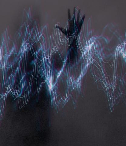 Silhouette behind distorted sound waves