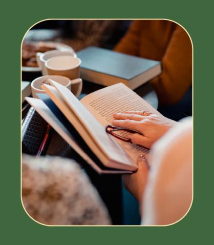 Woman reading book inside