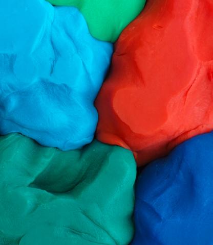 Several colors of playdough squished together