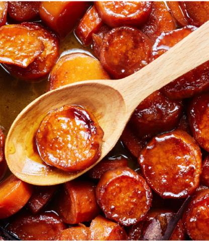 Glazed sweet potatoes on a wooden spoon
