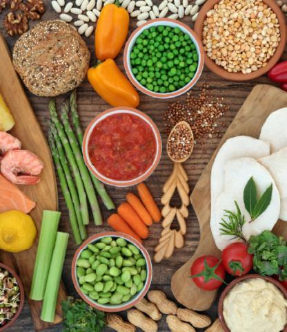 Photograph of various fresh produce, shrimp, and cheese