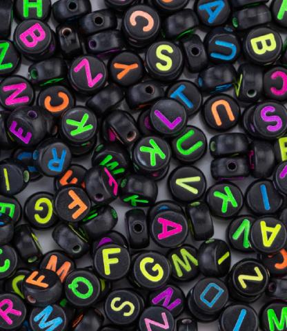 Black beads with neon-colored letters