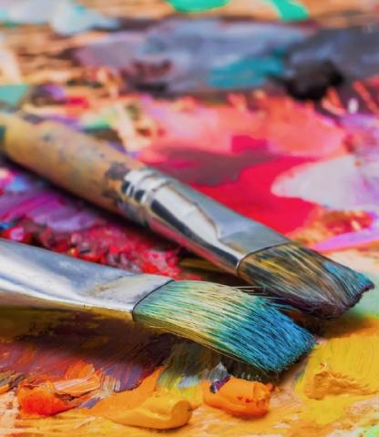 Paint Brushes on Messy Palette 