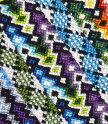 Close up of various woven bracelets