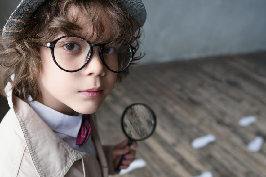 Young boy dressed as detective 