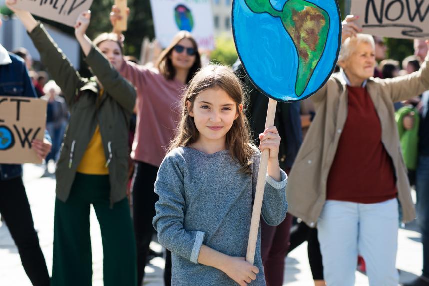 Young girl holding sign at protest