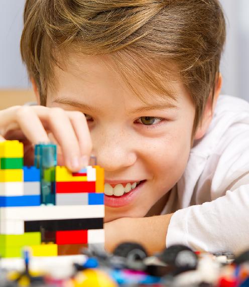 Young boy building with Lego blocks