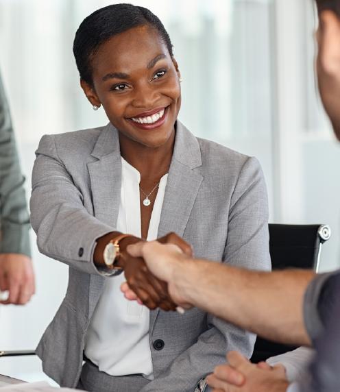 Business woman shaking hands with business man