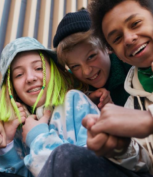 Diverse teenagers sitting together