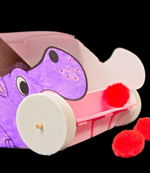 Papercraft sweeper with red balls, a pink scope, and a purple hippo design