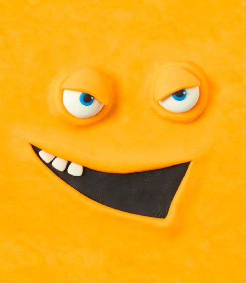 Orange cartoon face made out of clay