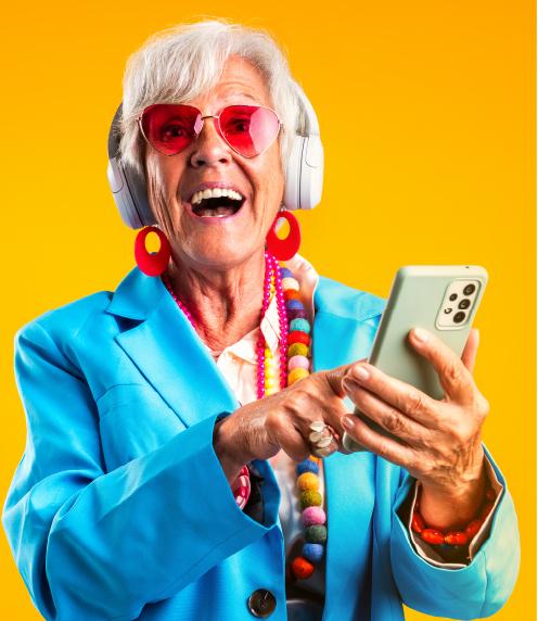 Excited senior woman using smartphone