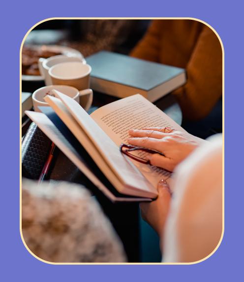 Image: Woman reading book inside.