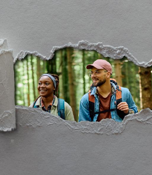 Grey paper, torn away to revel two people in hiking gear in the woods