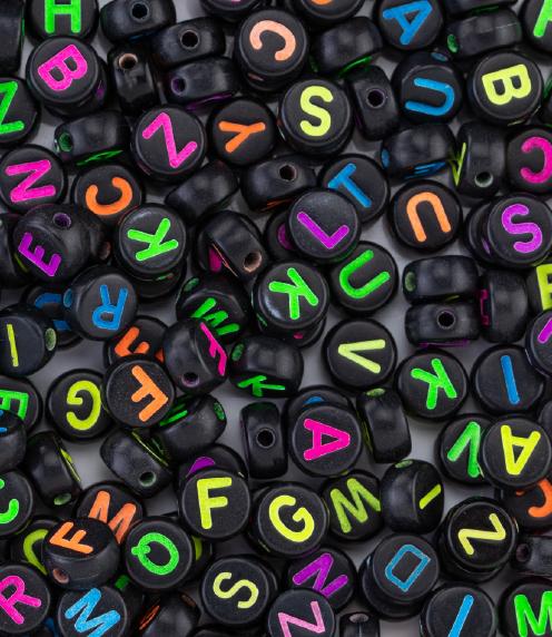 Black beads with neon-colored letters