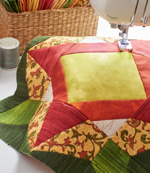 Quilt square sitting on a sewing machine